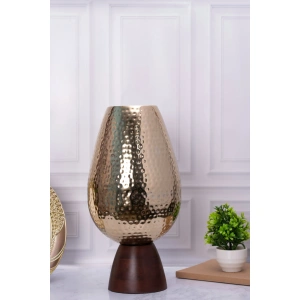 this is an image by the empty space that deals in premium home décor items online in India. The is an image of décor product of the empty spaces. The product is golden elegance vase with wooden base which is made in India.