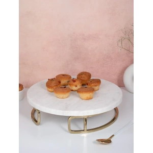 this is an image by the empty space that deals in premium home décor items online in India. The is an image of tableware product of the empty spaces. The product is white marble cake stand which is made in India.